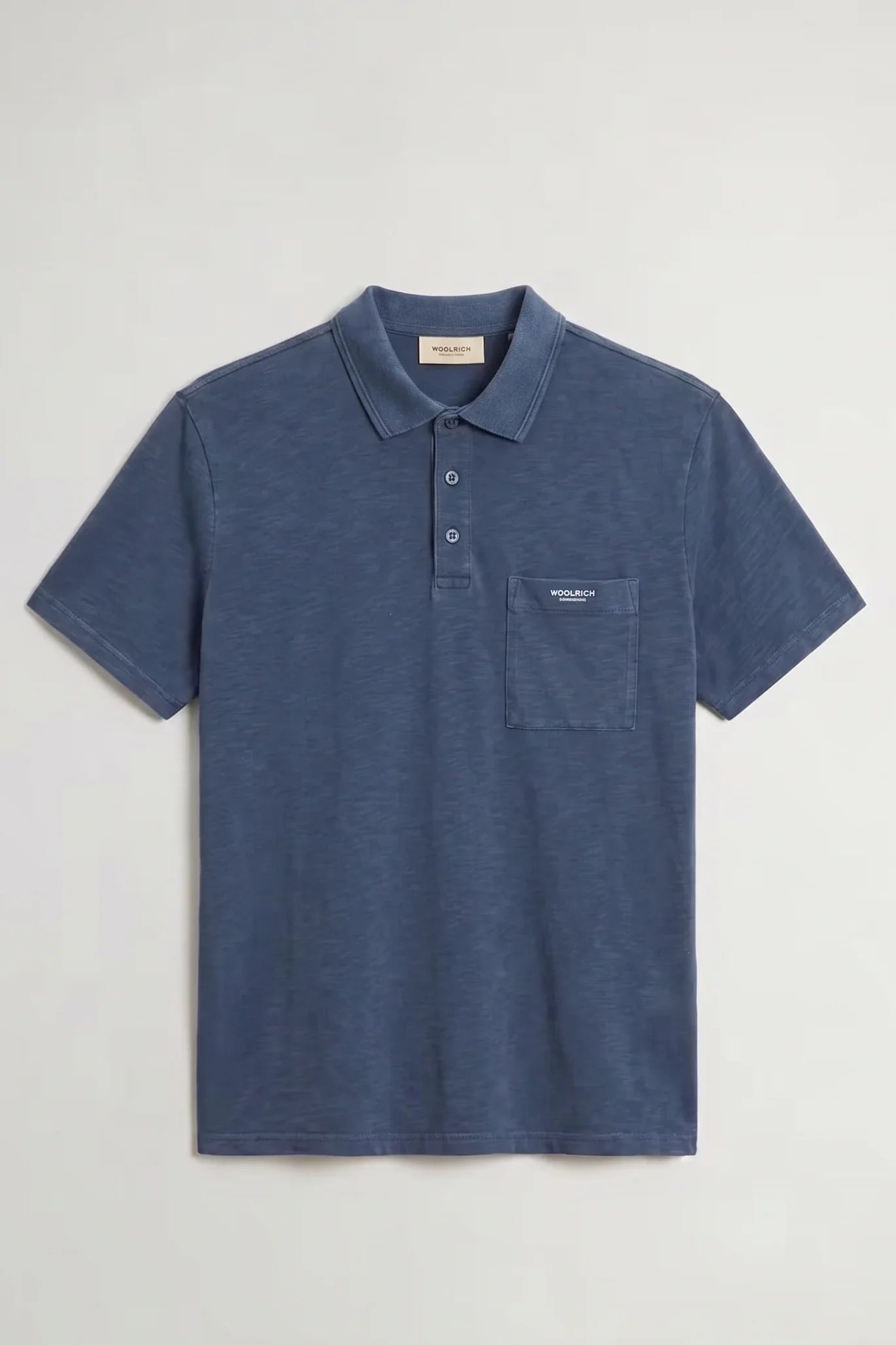 Polo uomo blu in cotone con taschino e logo Woolrich, manica corta, stile casual elegante