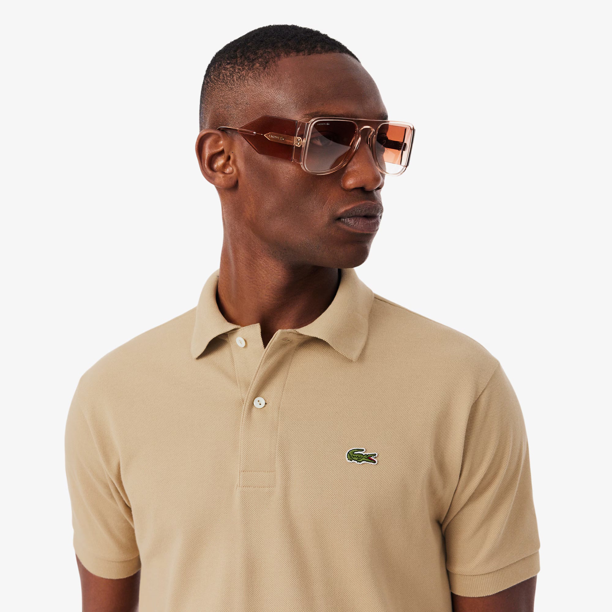 Polo Lacoste L1212 02S classico, colore blu, tessuto morbido, dettaglio logo crocodile sul petto, taglio regolare.