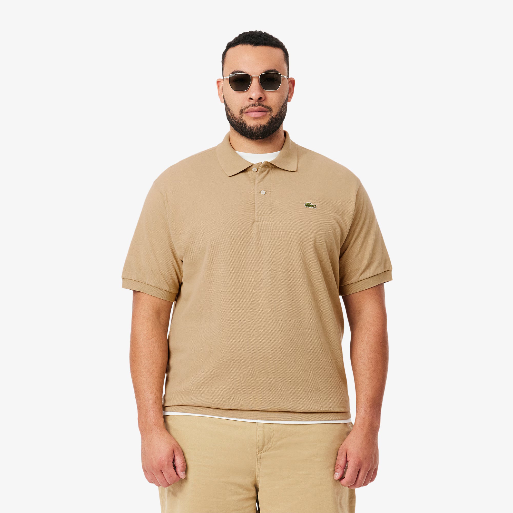 Maglietta polo LACOSTE L1212 02S classica, colore blu, con colletto a coste e logo crocodile sul petto, vista frontale.