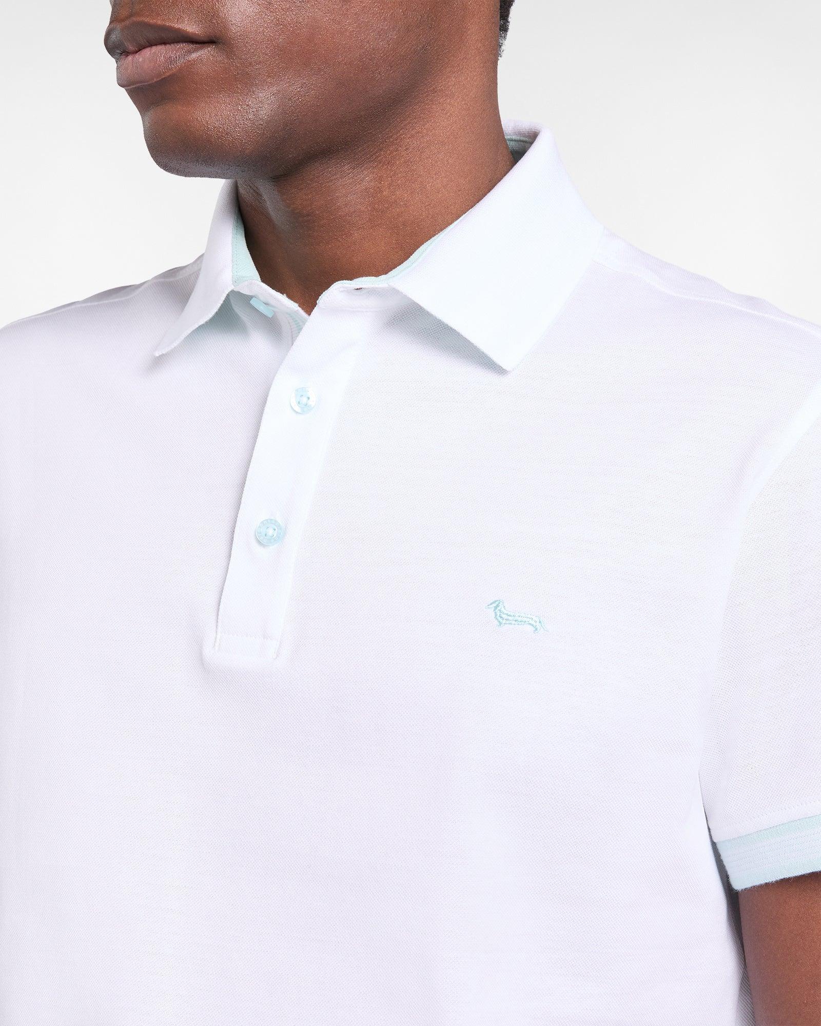 Polo uomo bianca con colletto classico, bottoni azzurri e logo ricamato lato cuore