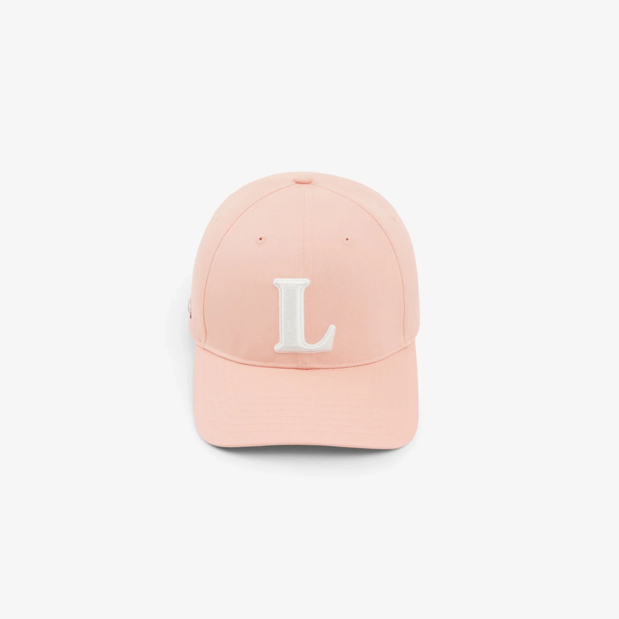 Cappellino rosa con visiera e lettera L bianca ricamata sul davanti, stile casual unisex.