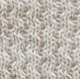 Dettaglio trama maglia beige in lana per abbigliamento moda uomo donna