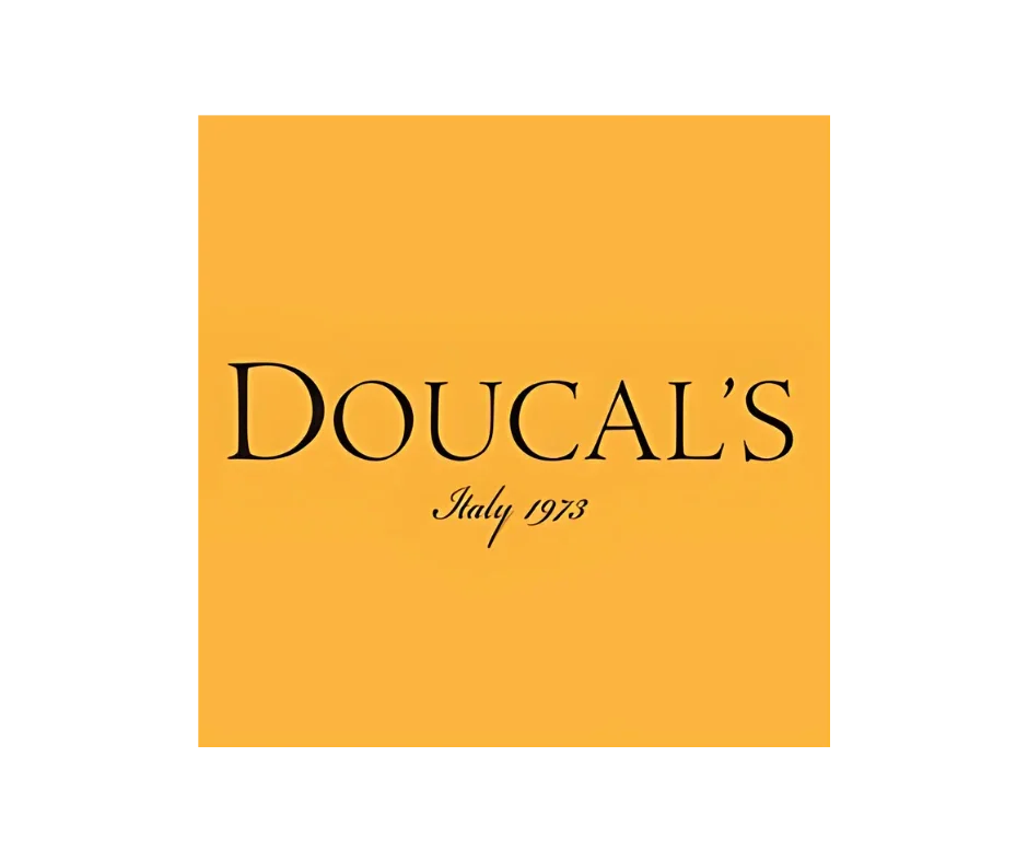 Logo Doucal's su sfondo giallo con scritta Italy 1973, design elegante.