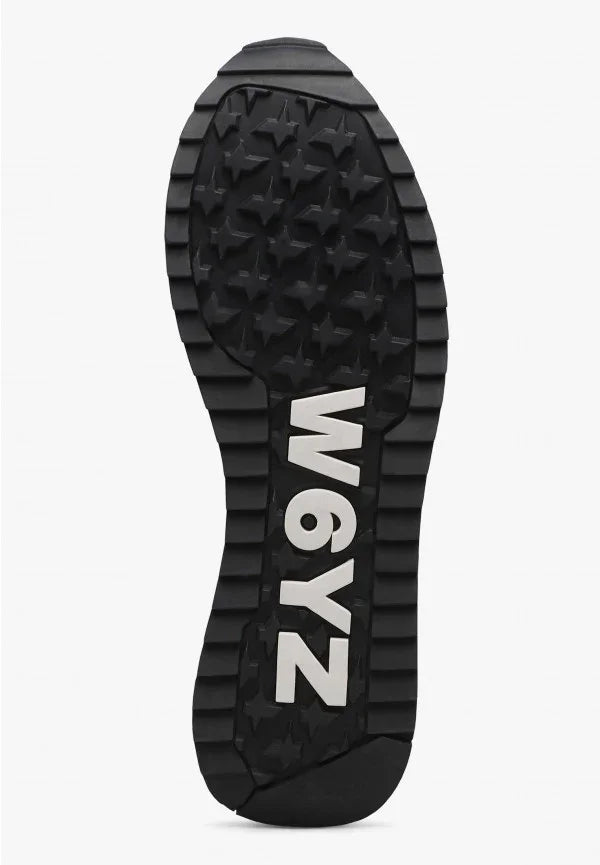 Suola scarpa nera in gomma W6YZ con rilievi a stella e logo visibile, calzature uomo donna.
