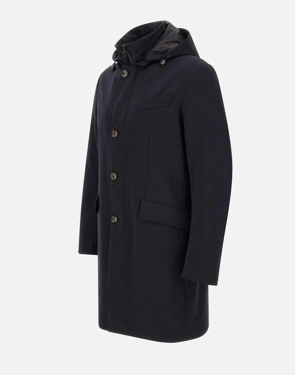 Parka blu imbottito da uomo con cappuccio e bottoni, stile elegante invernale.