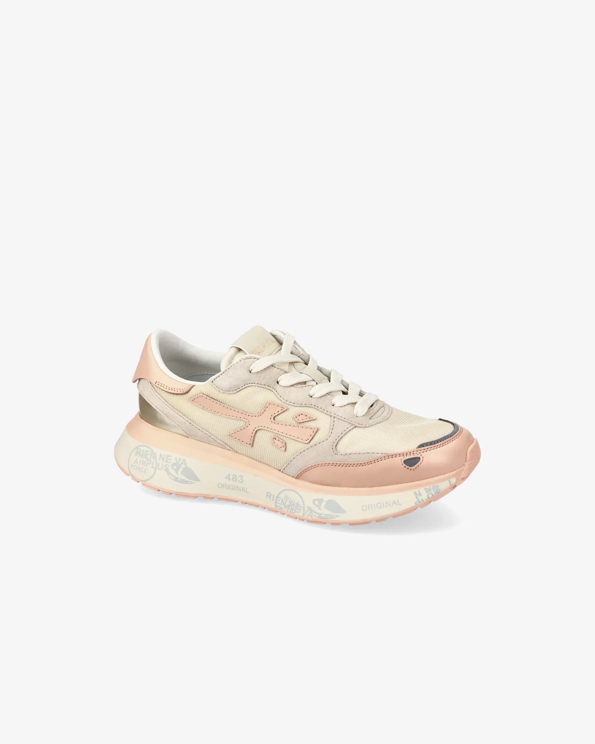 Sneaker beige e rosa da donna con dettagli a contrasto e suola decorata, vista laterale.