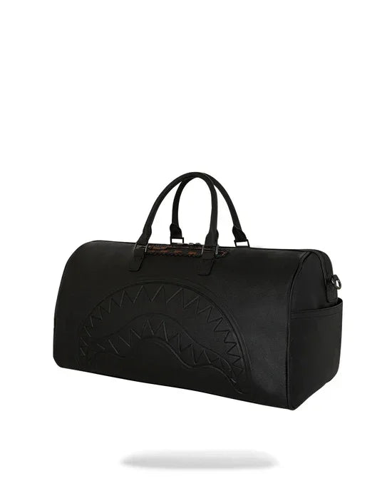 Borsone da viaggio nero con motivo trapuntato a denti, doppio manico, stile moderno ed elegante.