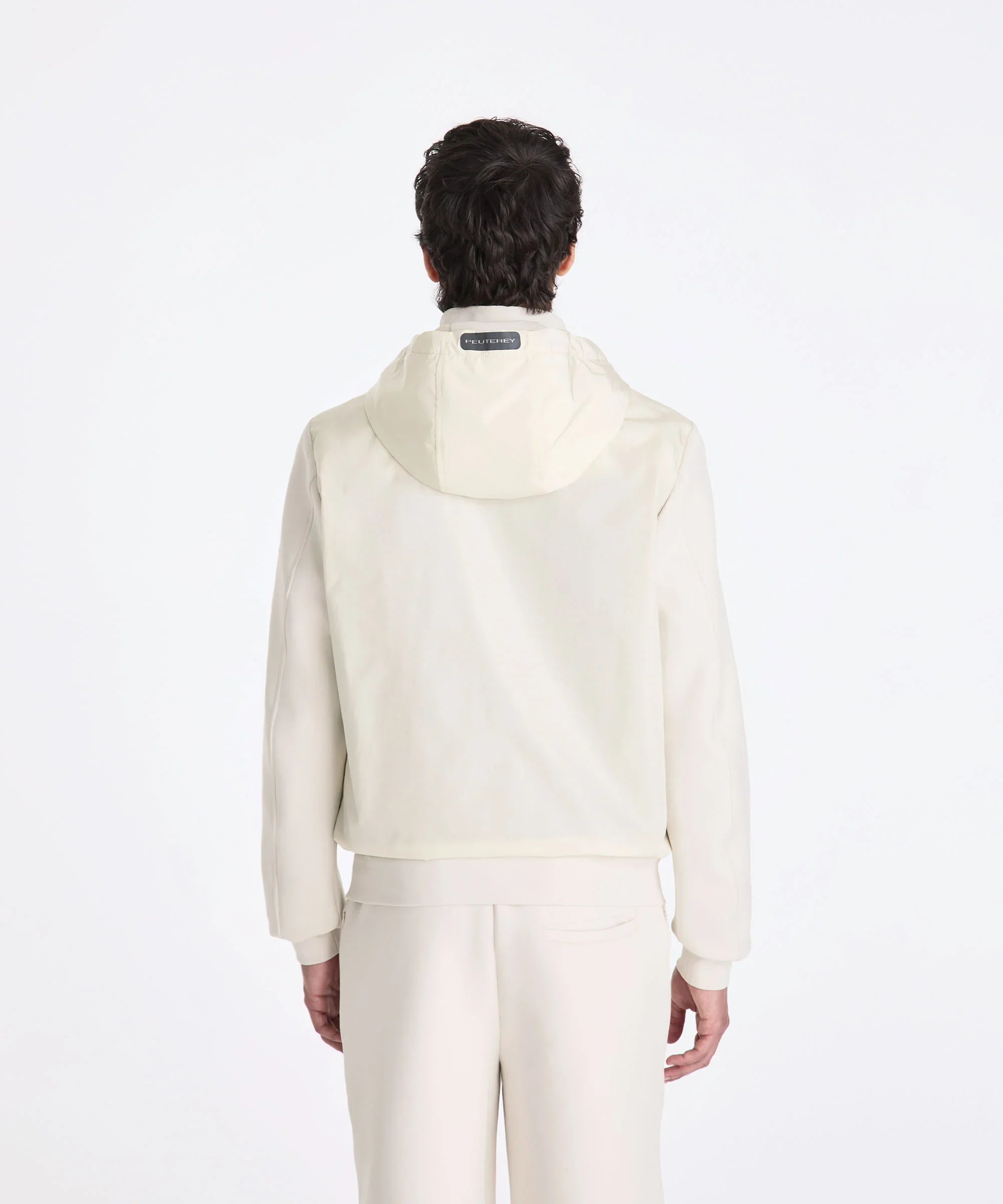 Giacca uomo Peuterey bianca con cappuccio vista da dietro, abbigliamento elegante casual