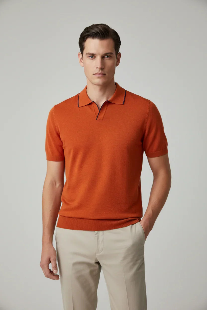 Polo uomo arancione a maniche corte, colletto con profili scuri, abbigliamento elegante